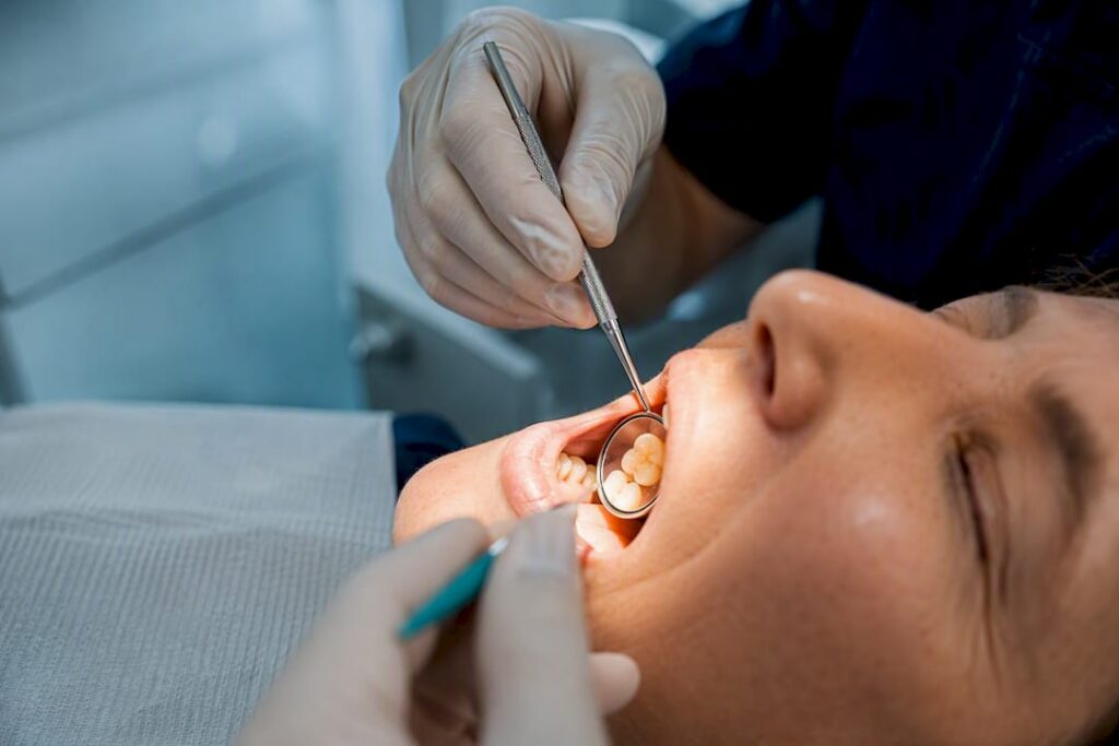 Dentist examining a cracked tooth